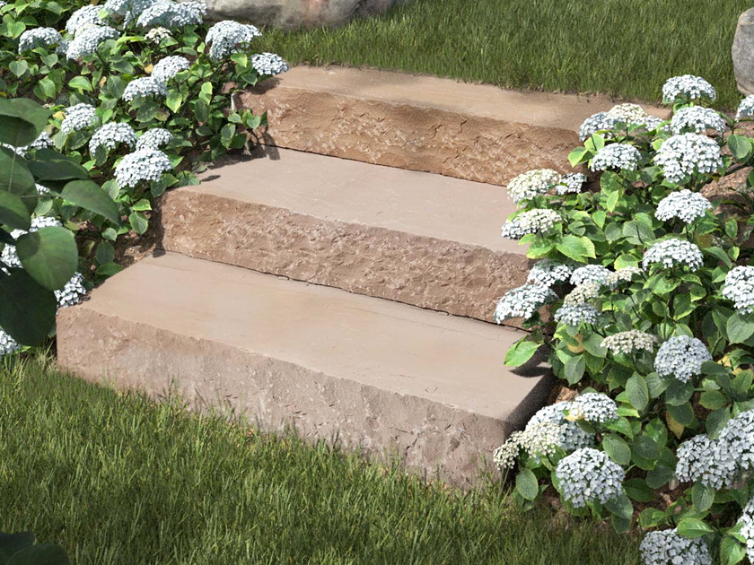 Muurblokken van Modak zandsteen met bloemen en struiken