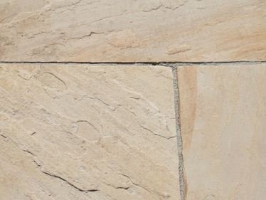 Close-up van beige zandsteen Gele munt