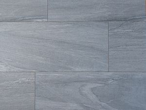 Steenlook tegels in grijs en wit van bovenaf gefotografeerd