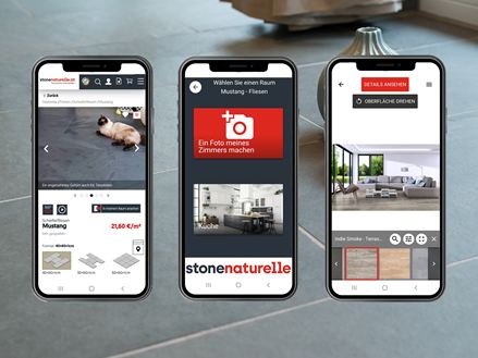 Leisteen met drie mobiele telefoons
